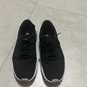 Nobull running shoes.  Women size 7 and men 5.5